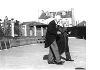 Two masters walking across the main quad, Speech Day, c1940.