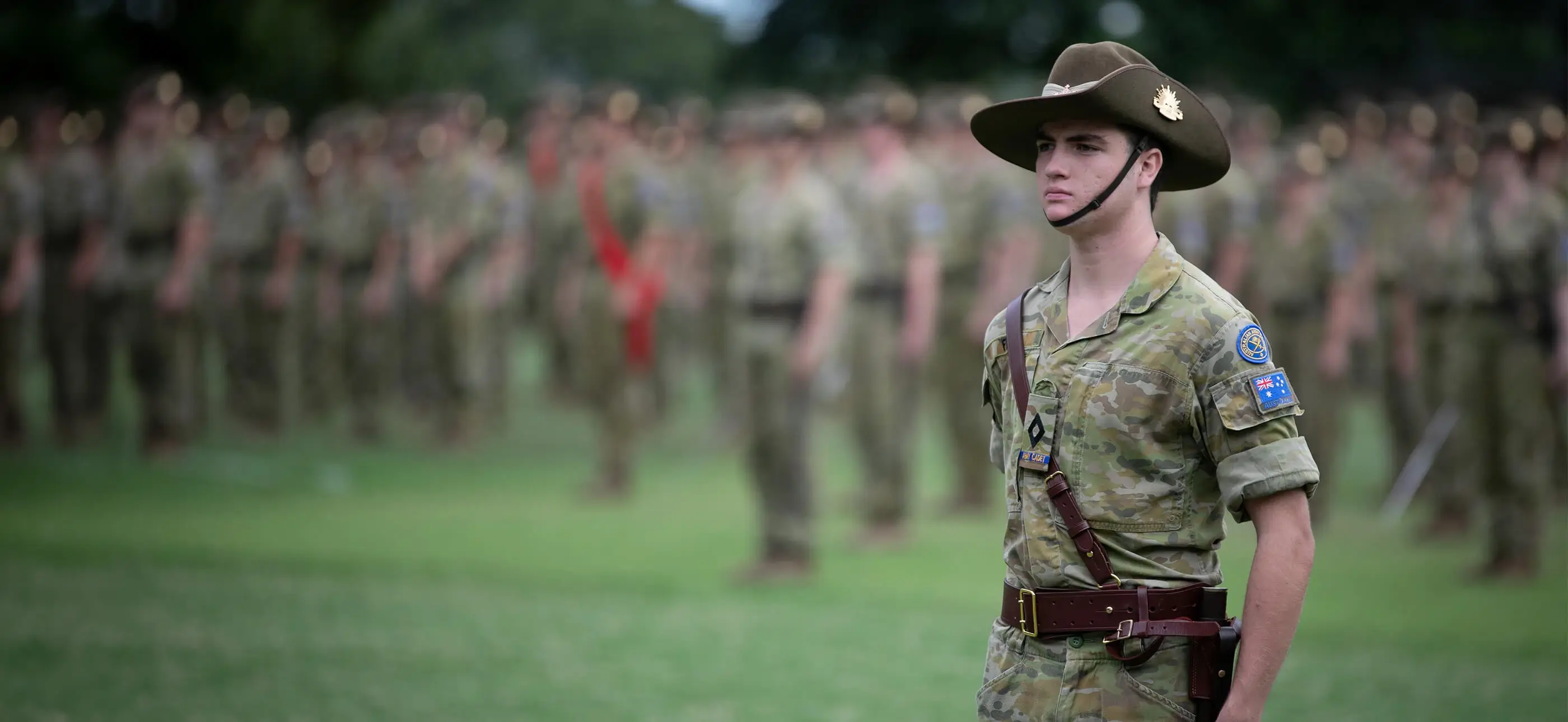Shore Australian Army cadet standing at attention during an outdoor parade formation.