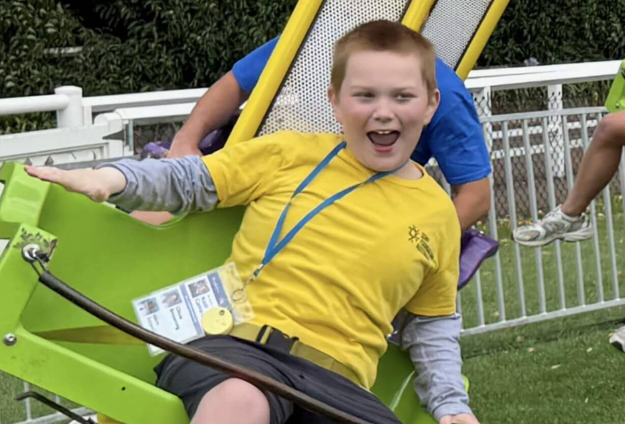 A Child on a spinning carnival ride